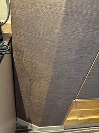 Stains on walls & carpet worn & dusty