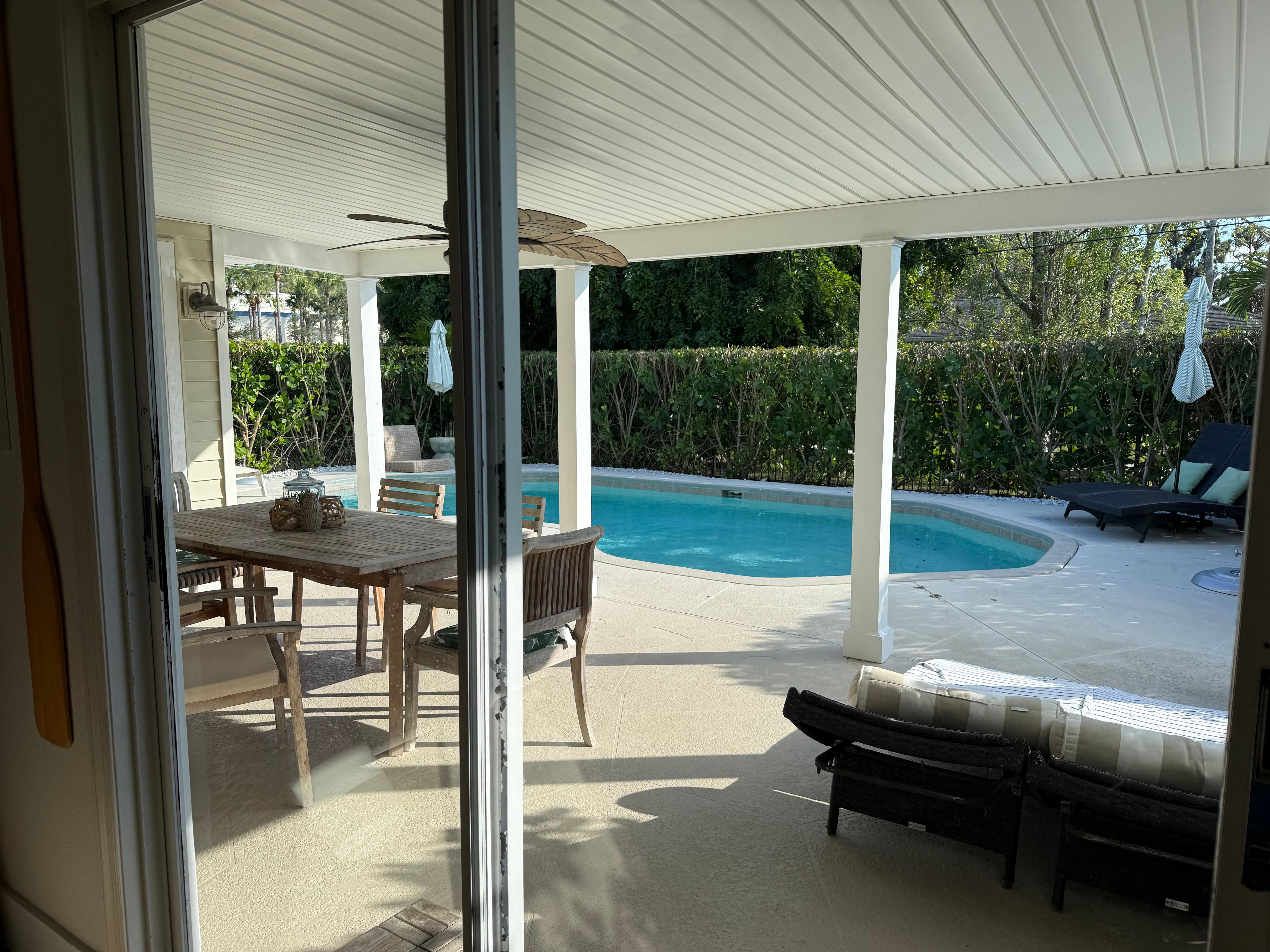 View from living room-Patio dining next to pool
