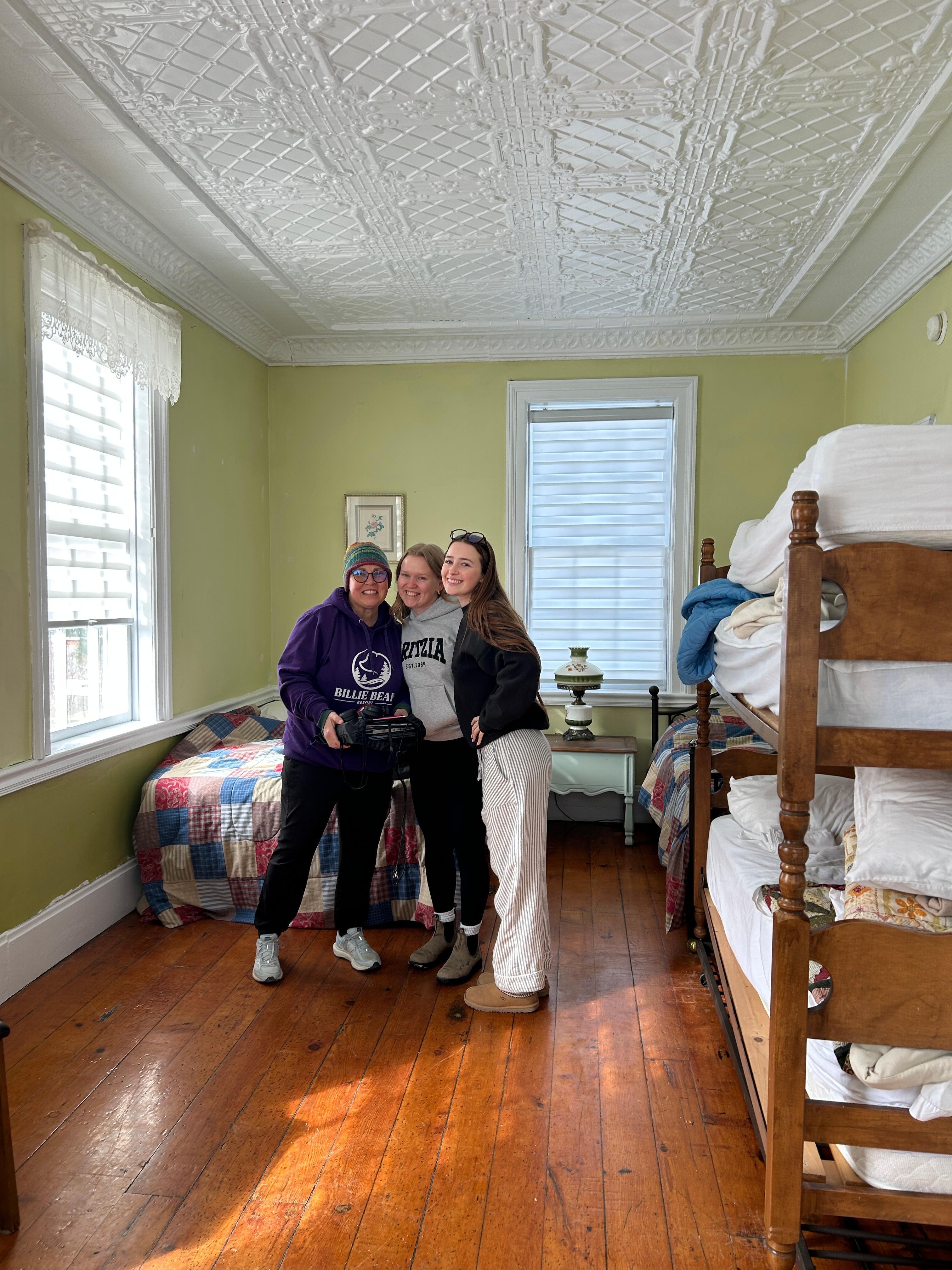 7th bedroom on the main floor - 4 singles, 1 double ... room for blow up mattresses for sure !