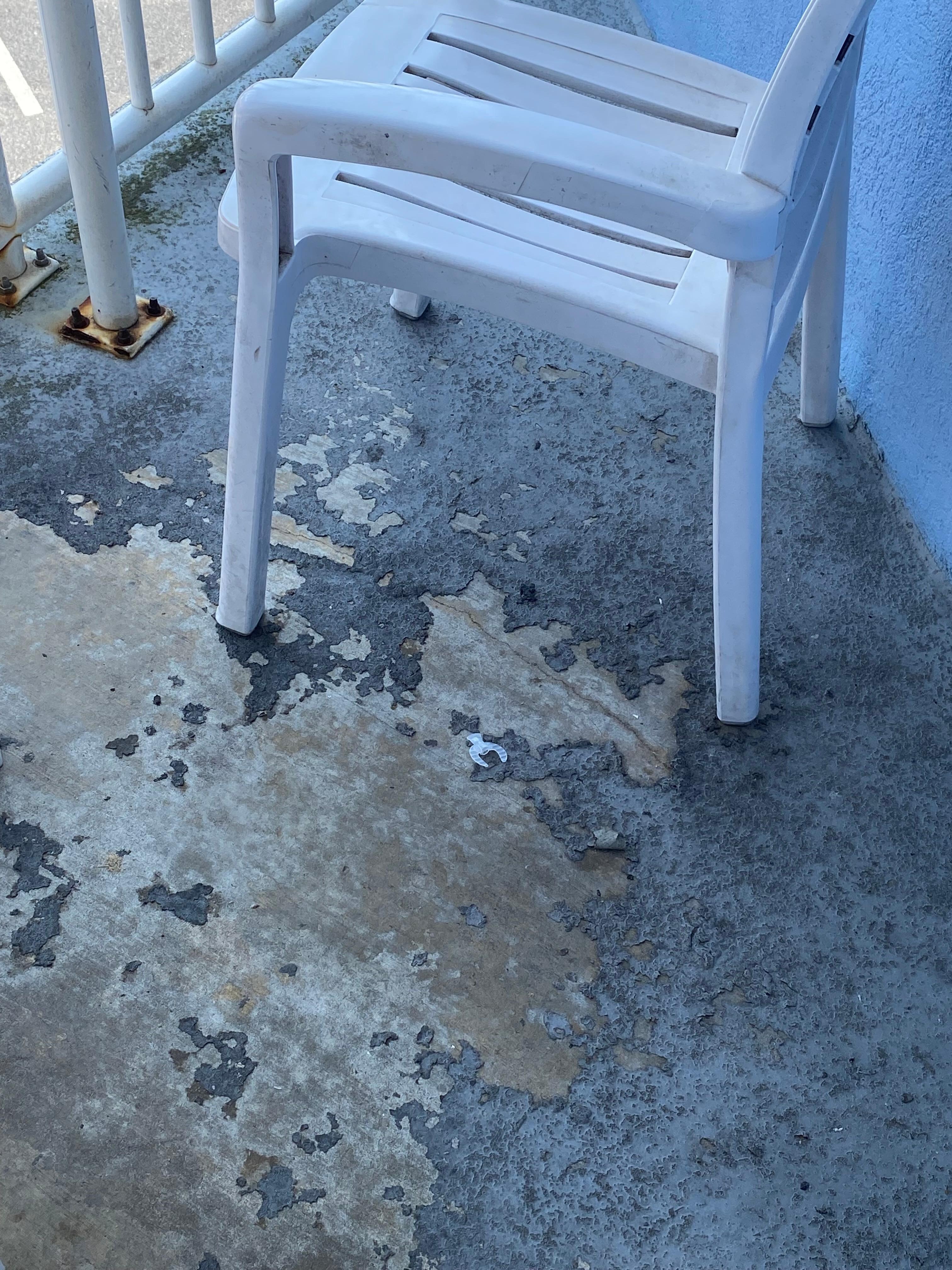 Porch furniture dirty and floor covering chipped and pealing