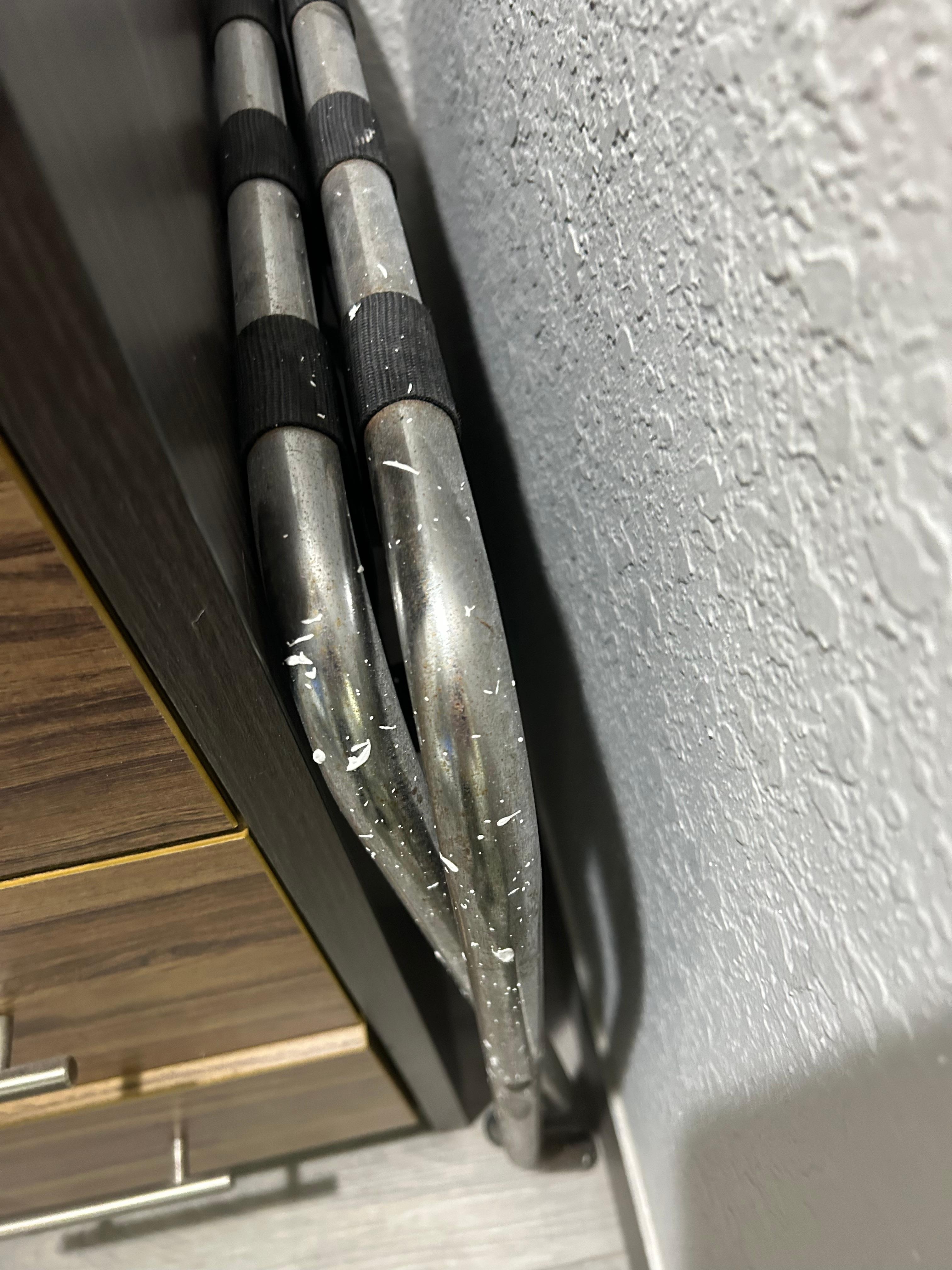 Luggage rack with paint all over it