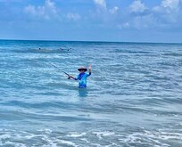 Fishing in the surf.