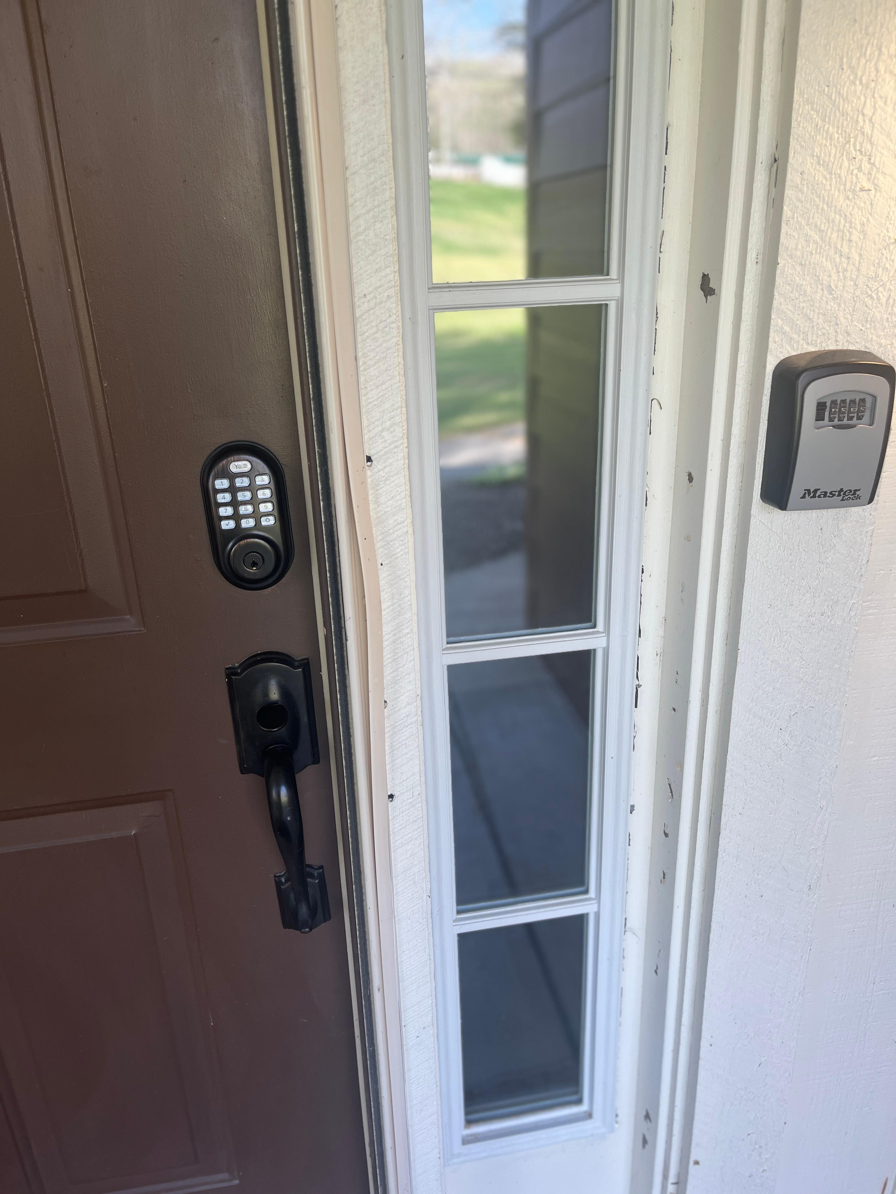This is the keypad located above the door handle that allows entry into the house