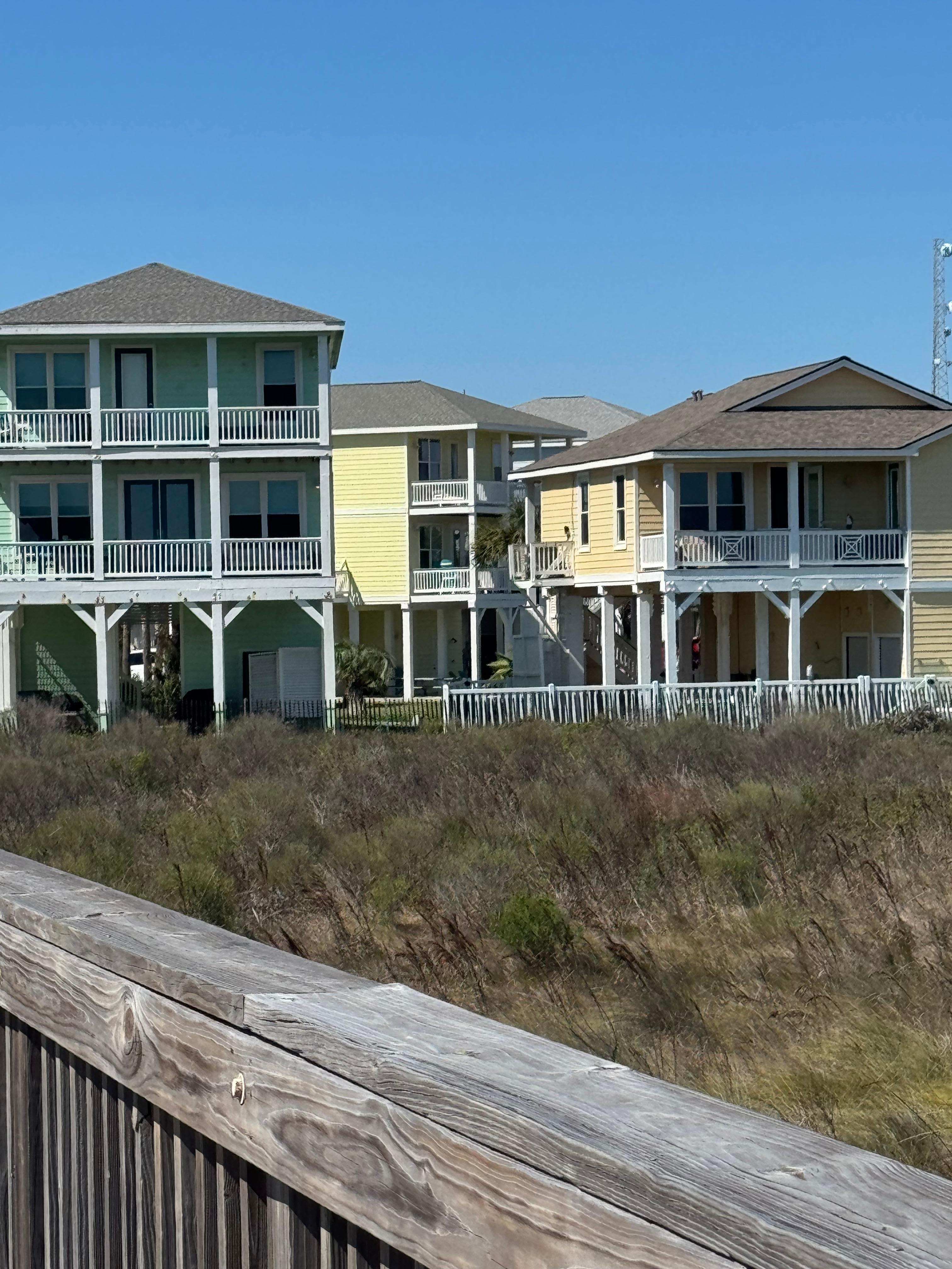 View of the house from the boardwalk. It’s the yellow house in the middle. 