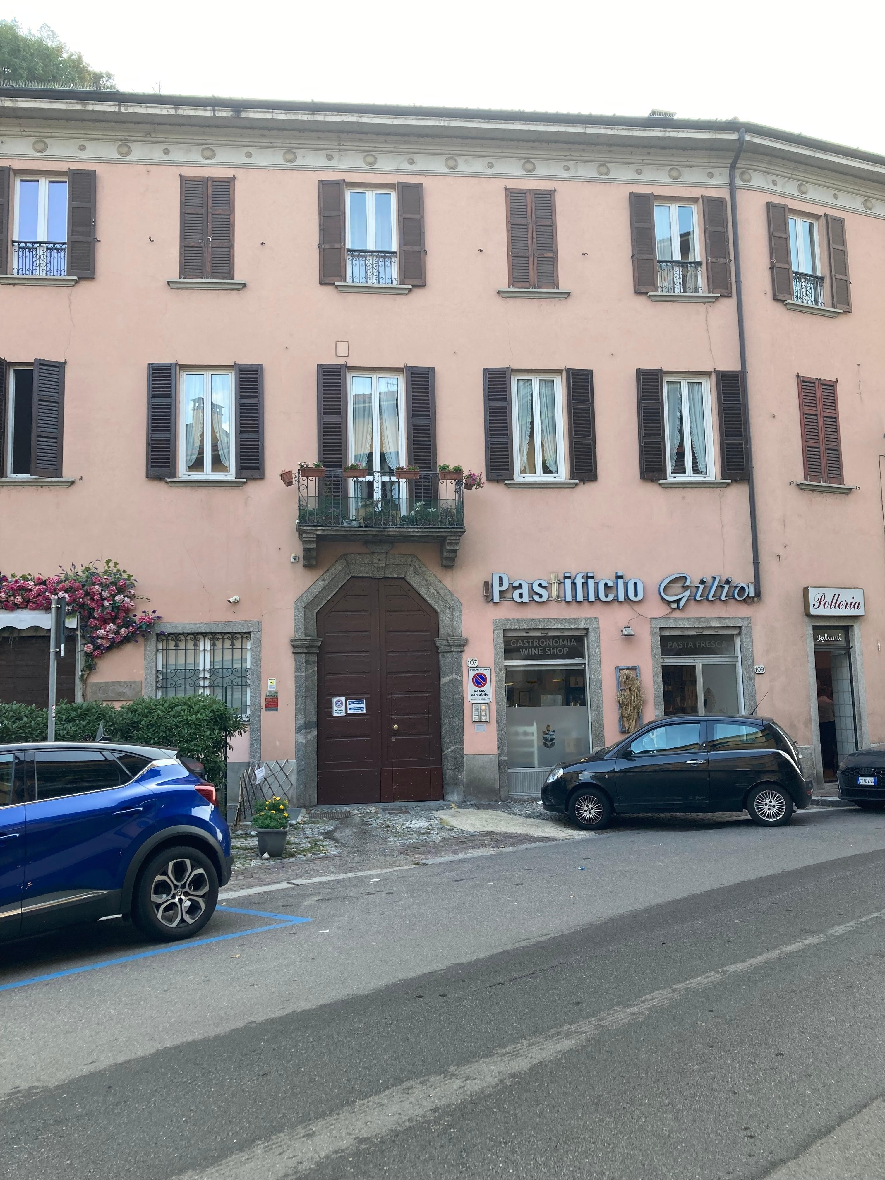 Apartment exterior with butcher, pasta shop and restaurant in building