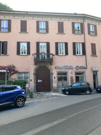 Apartment exterior with butcher, pasta shop and restaurant in building