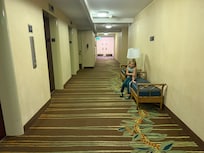 Outside our room, 6th floor. My son sitting on bench