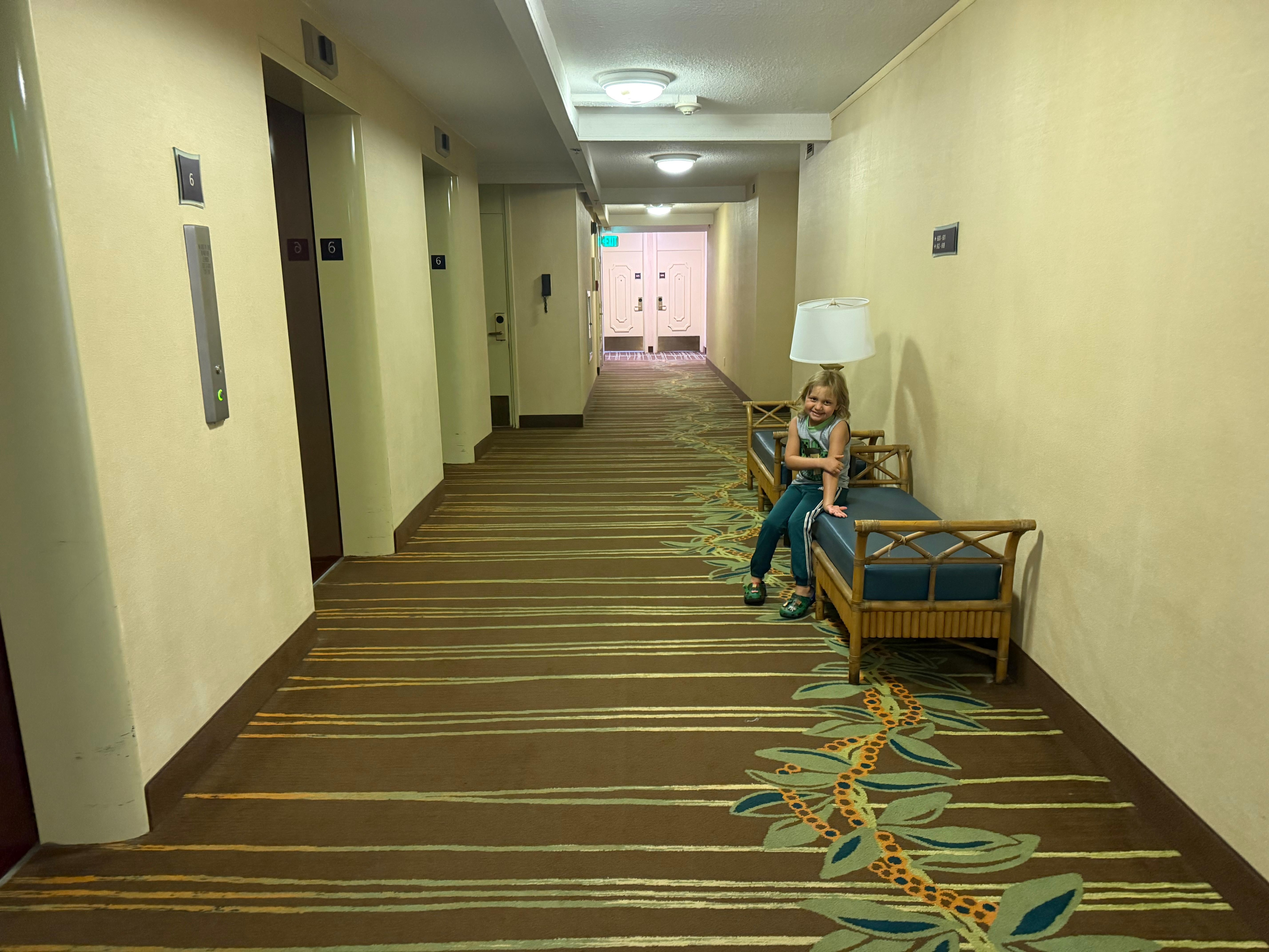 Outside our room, 6th floor. My son sitting on bench