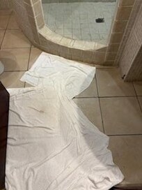 Leak of water on bathroom floor