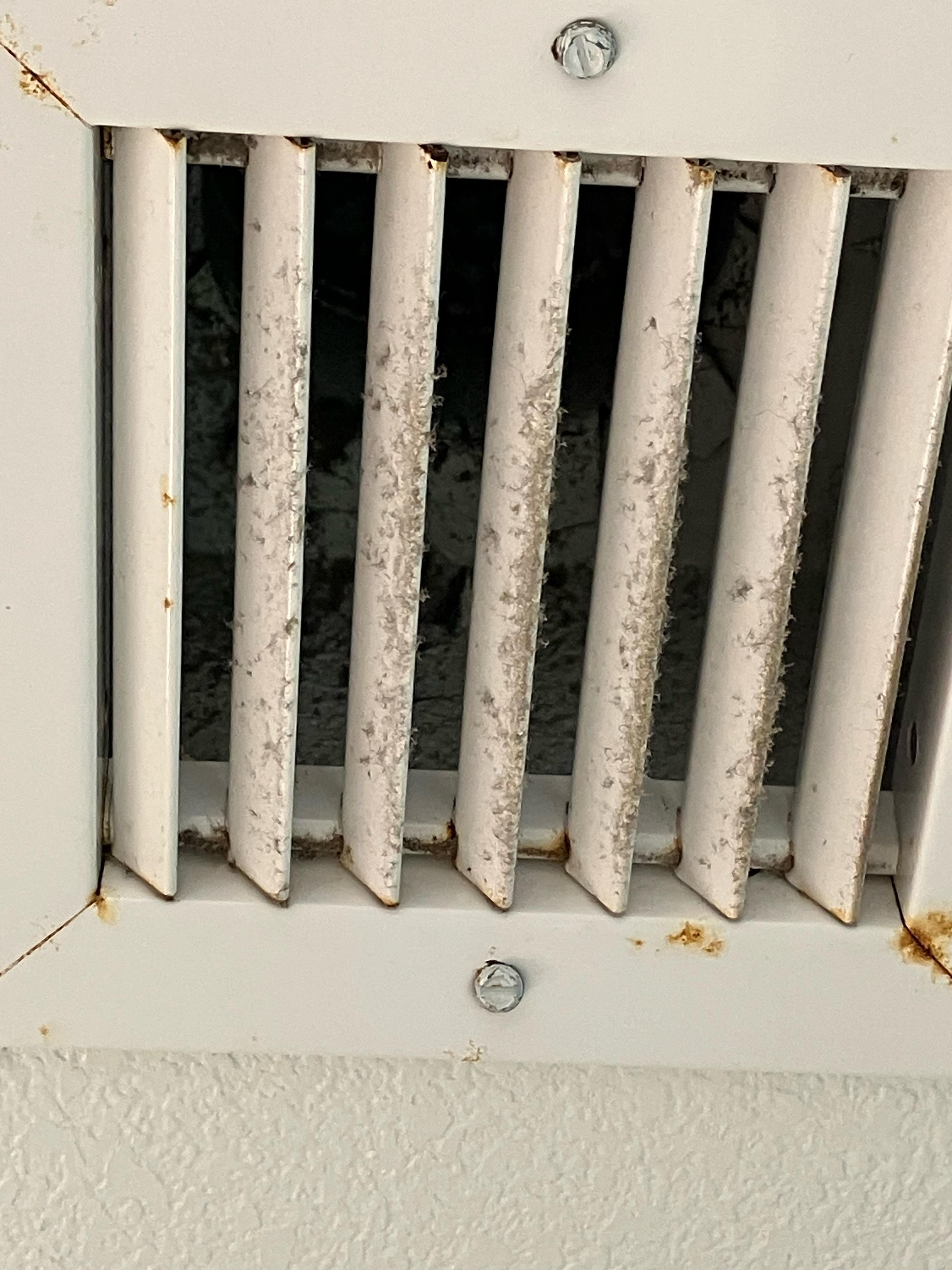 Dusty air vent in bathroom
