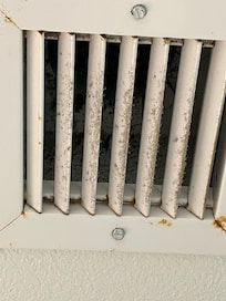 Dusty air vent in bathroom