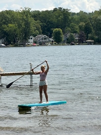 Granddaughter paddle boarding.