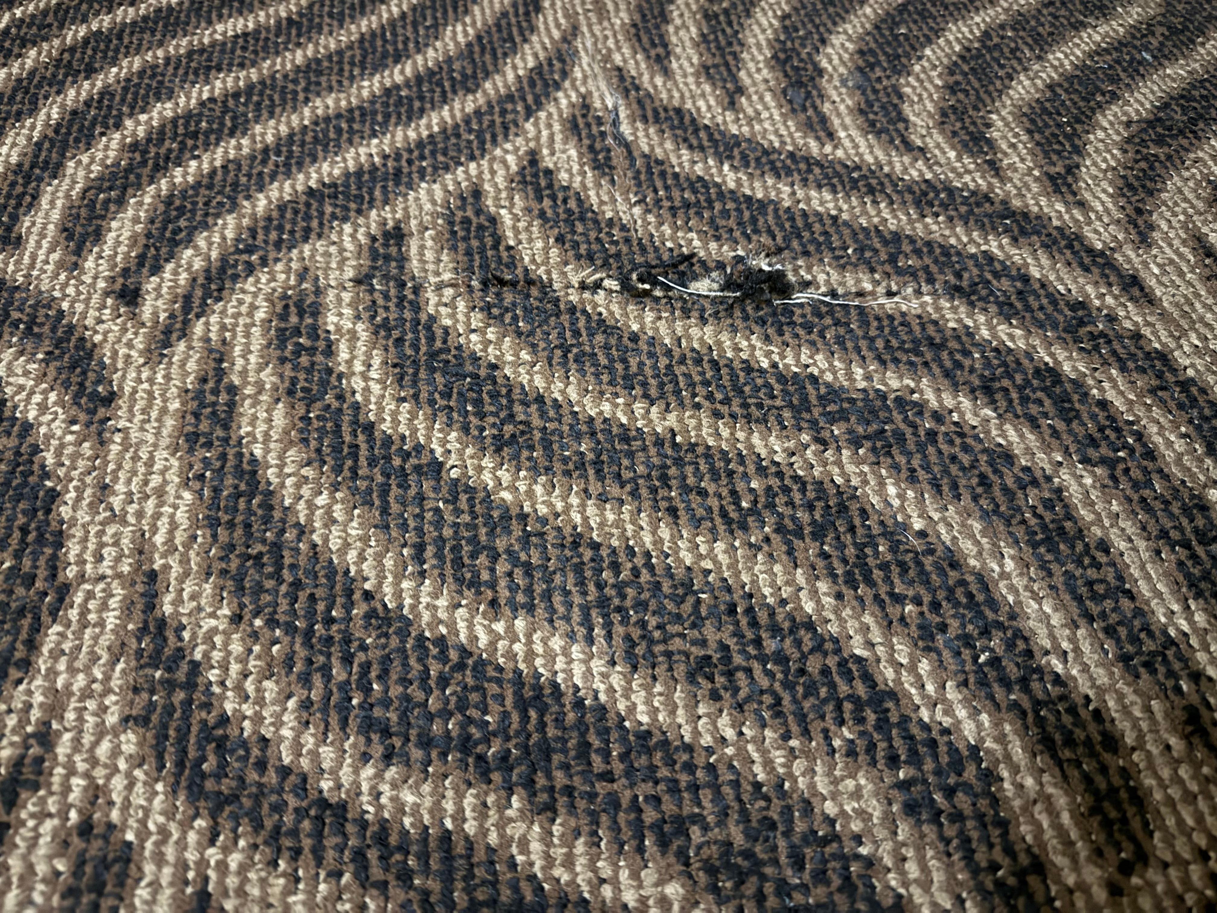 The carpet was torn in several areas