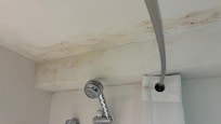 Water damage in shower ceiling
