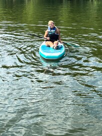 In the lake, ready to paddleboard.
