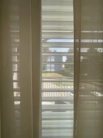Balcony with automatic blinds controlled at the light switch.