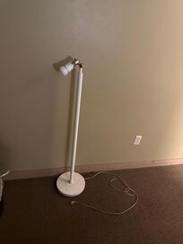 Broken lamp with cord, just laying on the floor- tripping/fire hazard