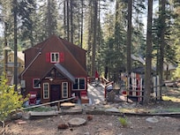 Front of the Cabin, the skis surround the hot tub