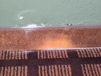 Someone just replaced carpet and left the old carpet/trim there. The whole thing is in terrible repair