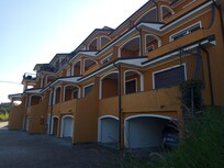 The apartment block, showing the garages on the lower floor.