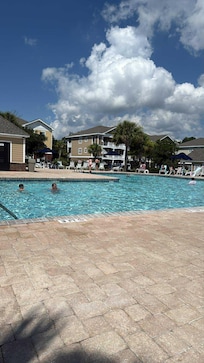Pool with building in background. Thats close!