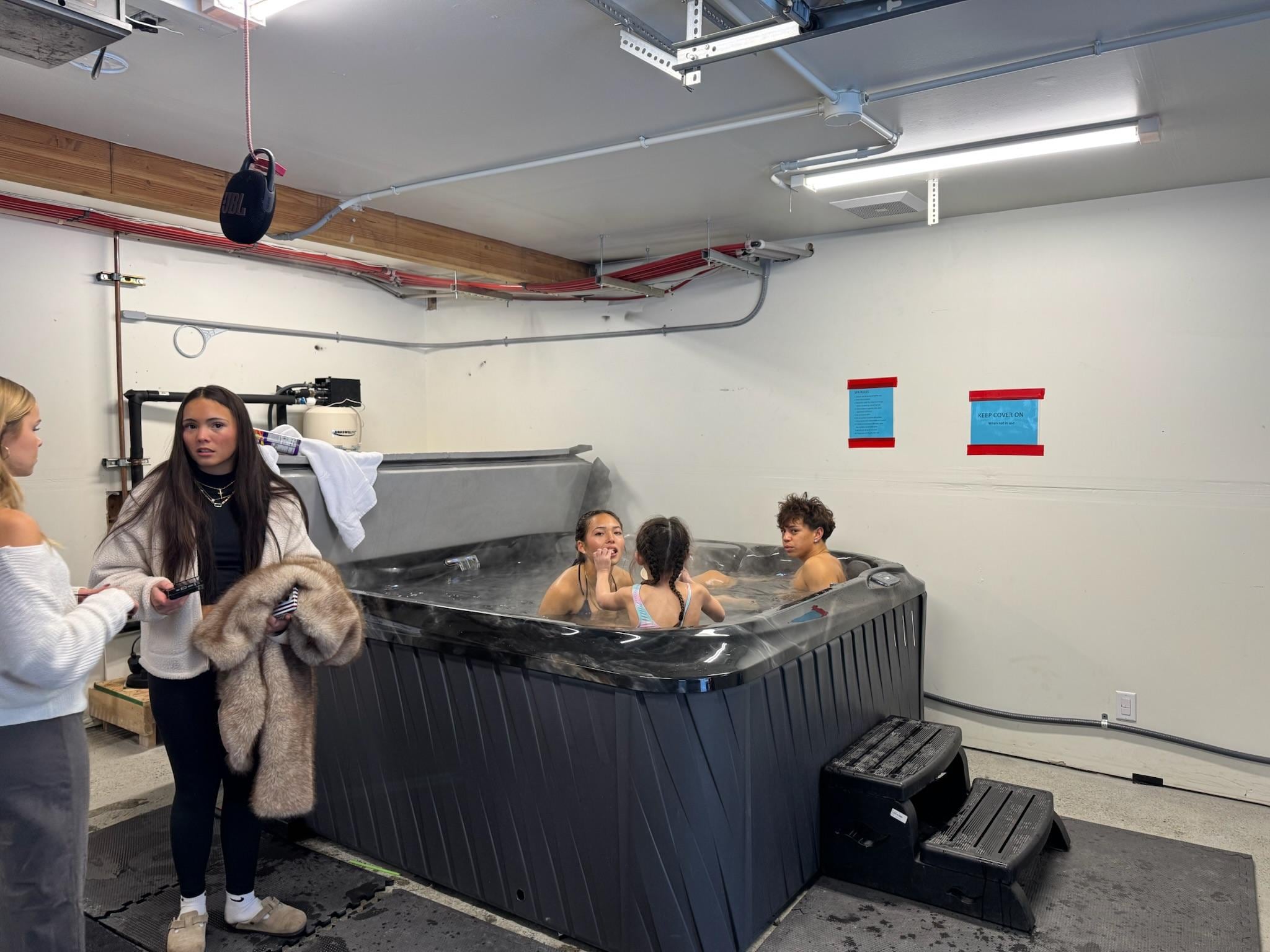 Hot Tub.  Indoor in the garage, but open the garage door and you are right on the snow. 