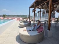 Bar on the right side, pool left side, jacuzzi at the end on the right side