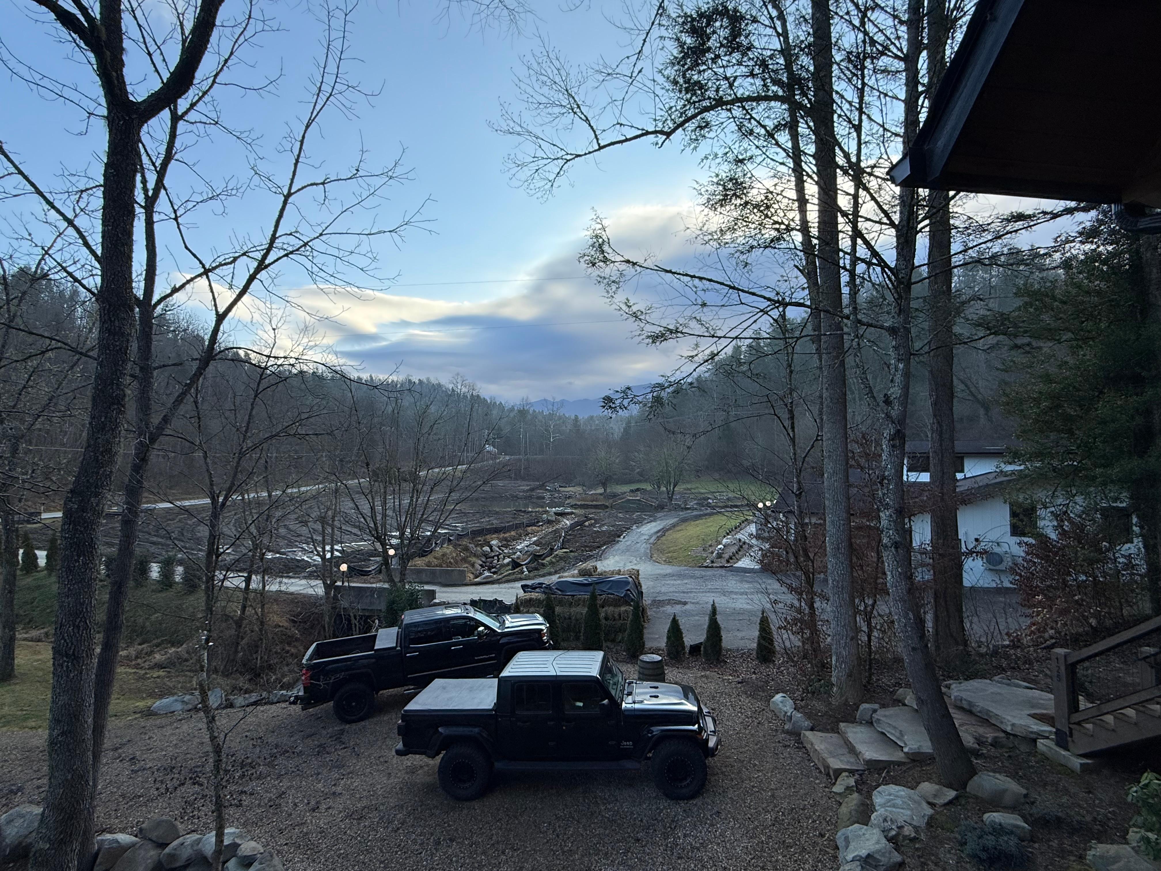 Our last morning here. Looking off deck up towards Greenbrier. Love they are rehabbing the house next door. Been looking at it for 50 yrs now. Sweet pond view coming up from the  deck!!