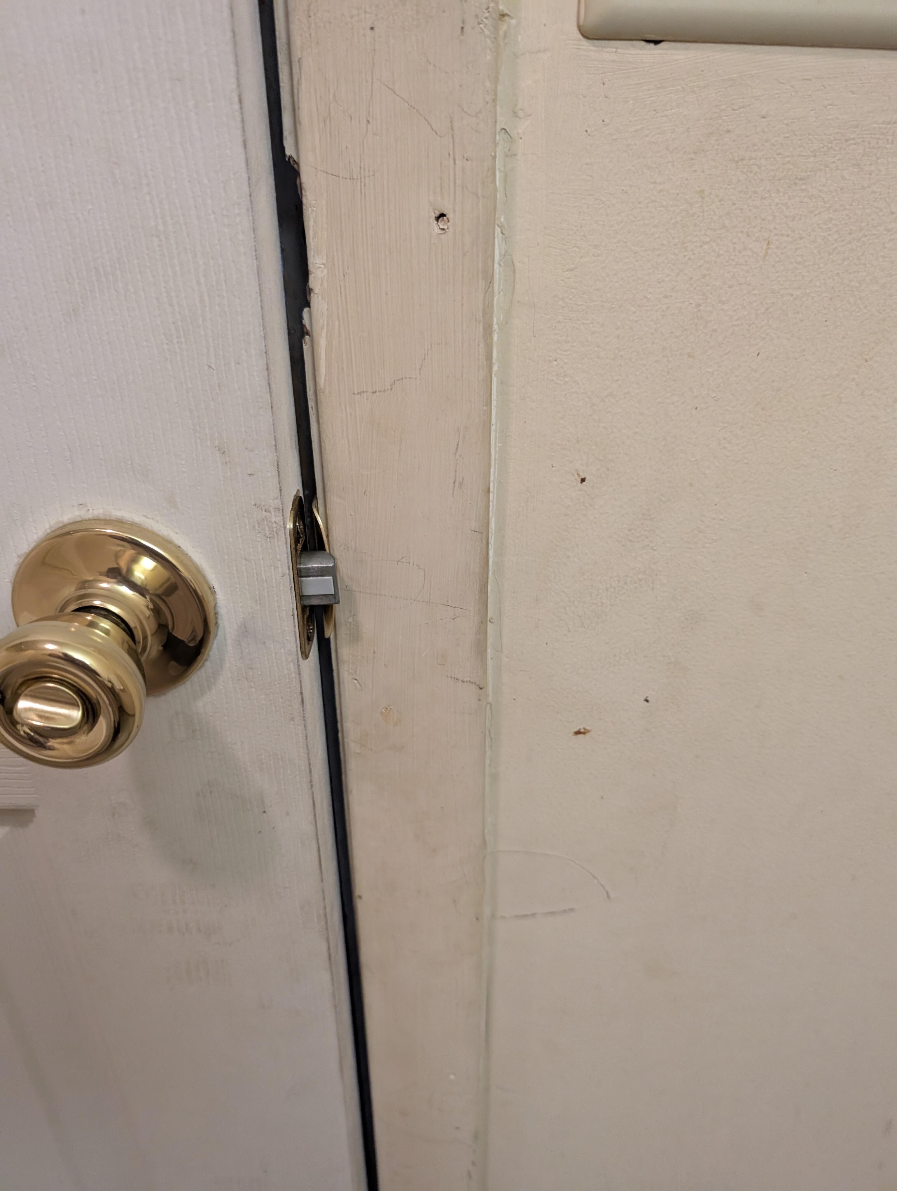 Bathroom wall by the door 