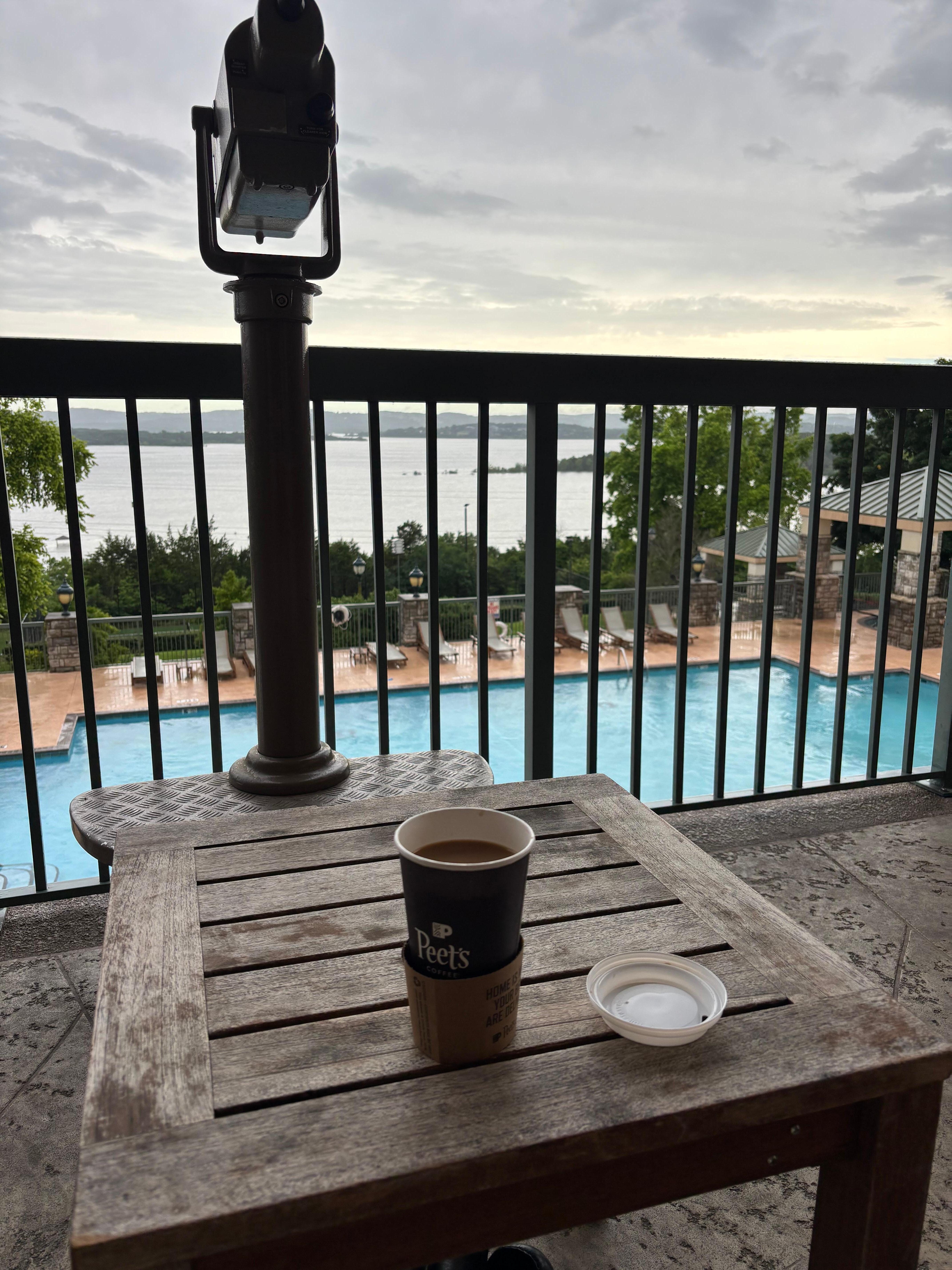 Downstairs balcony view overlooking pool and the lake