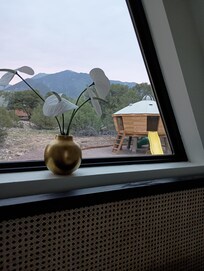 View of the UFO playhouse from the mini-A-frame. Our kids are a bit old for the playhouse but had a great time sitting in it like a fort while they enjoyed the backyard wireless connection.