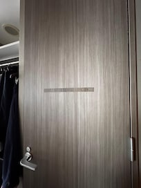 Damaged door finish pasted over with a sticker