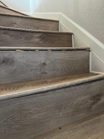 The lip on the stairs was loose and movable as you walked on them.