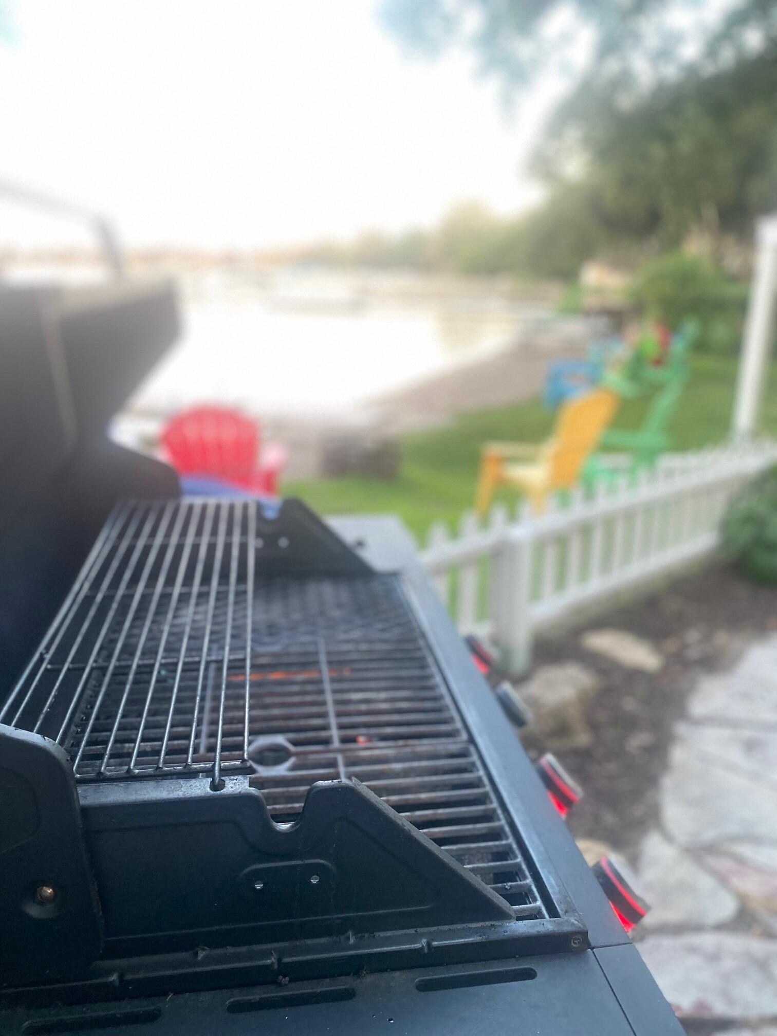Clean Grill in patio/garden area with extra gas tank.