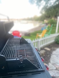 Clean Grill in patio/garden area with extra gas tank.