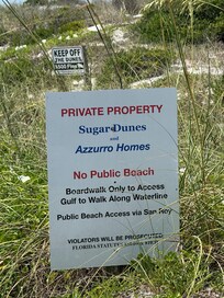 Sign telling you that you can’t setup on this beach