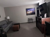 Living area of suite with pull out couch bed