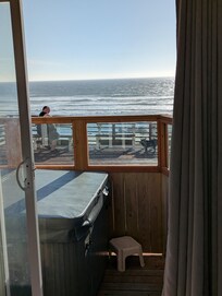 "Private Patio with hotub" as you can see bob and whoever else sits on those benches can see your entire room and hot tub. You can also see there's no table or chairs.