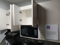 Empty and stained kitchen cupboards