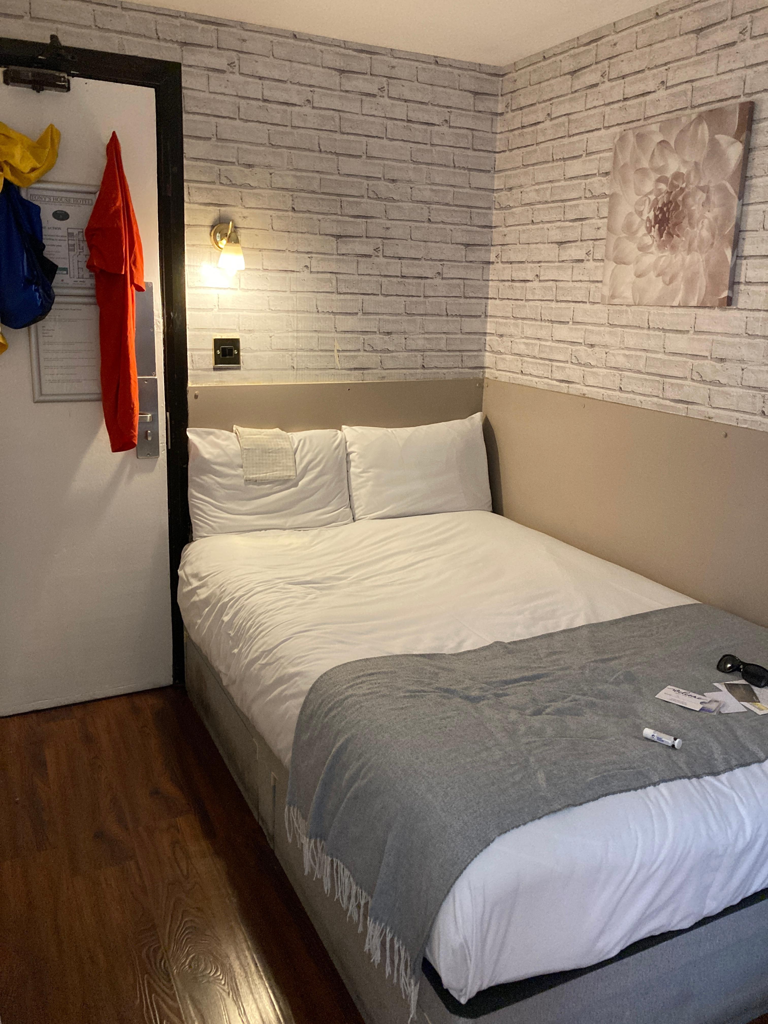 Tiny double bed for two small people, and against the wall so a little difficult to crawl out without disturbing the other.
