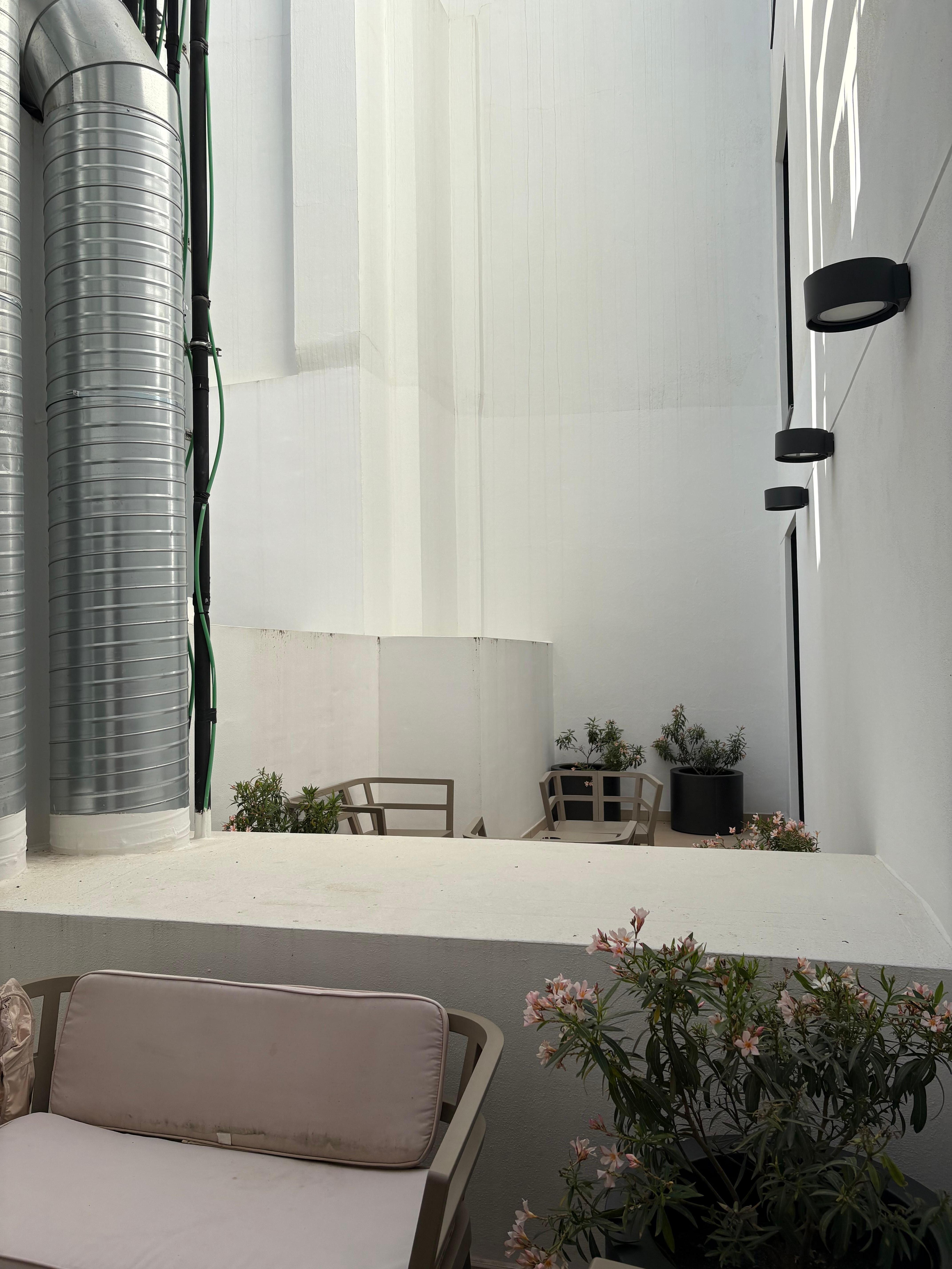 Lovely view of ventilation shafts and whitewashed interior walls