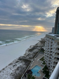 Beautiful balcony with cushioned chairs. Oh and of course the view.