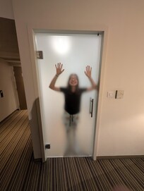 You can’t see through fully unless you are pressed against the glass lol but still slightly see through