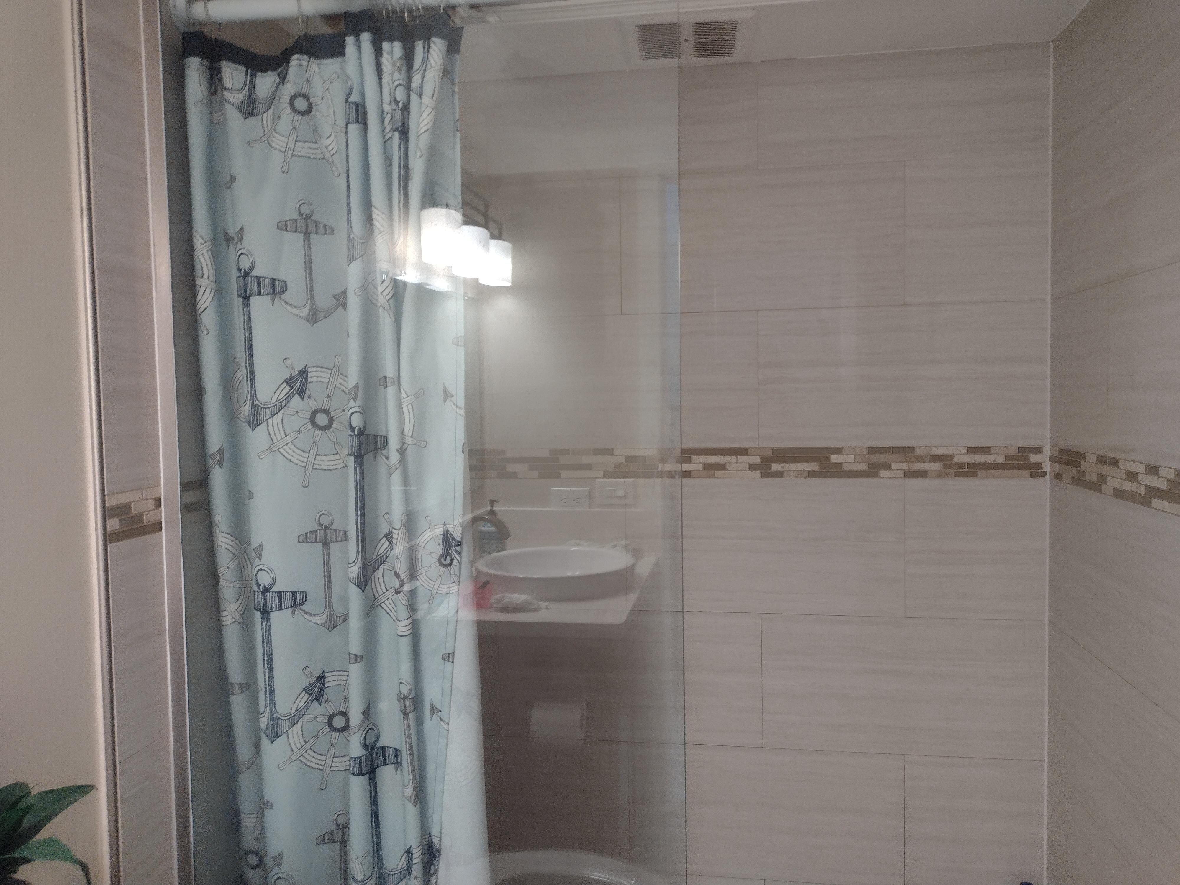 Broken shower door and they owners attempt to fix. 