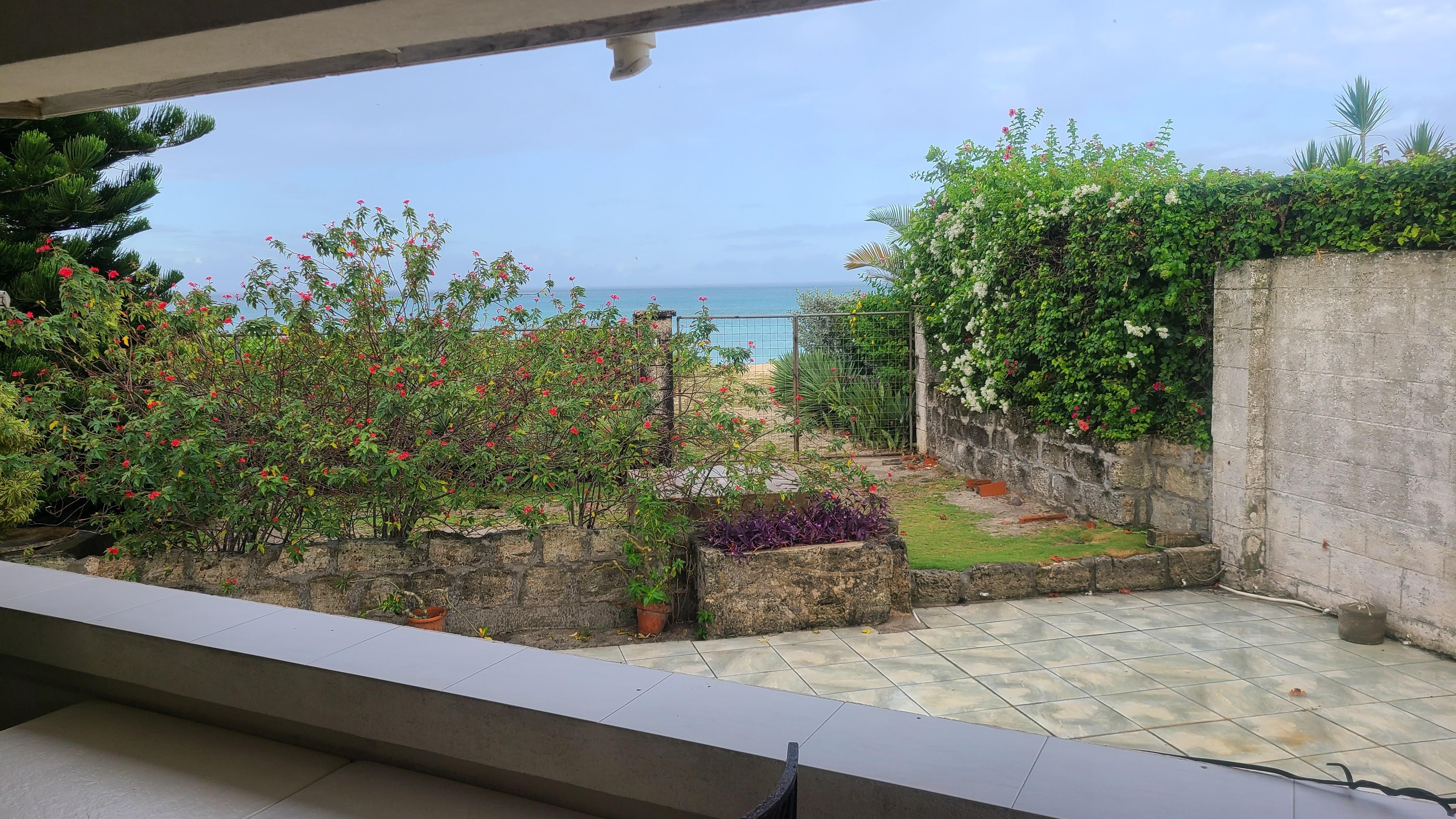 Garden gate to beach as seen from terrace. 