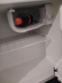 An opened soft drink left over by previous guests. What a dirty hotel. Still called "comfort"?"