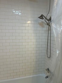 Shower head broken so you have to crouch down up against the wall to use the water. The tub was filthy