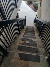 Unsafe stairs leading to second floor.