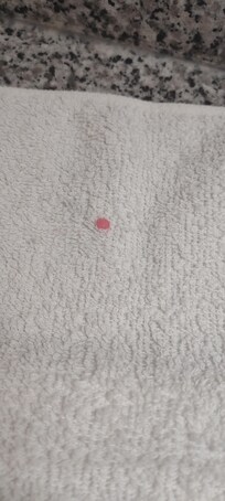 Pink substance on hand towel