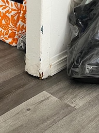One of many chipped, dirty baseboards